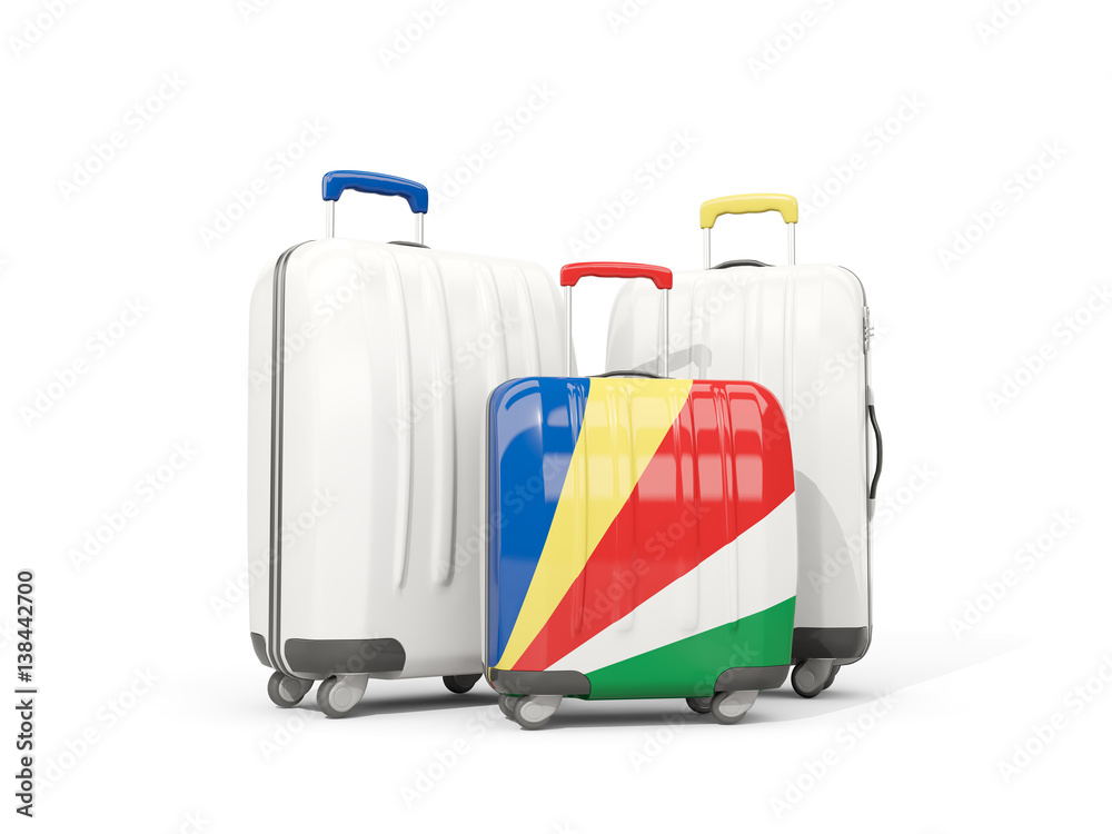 Luggage with flag of seychelles. Three bags isolated on white Luggage with flag of seychelles. Three bags isolated on white