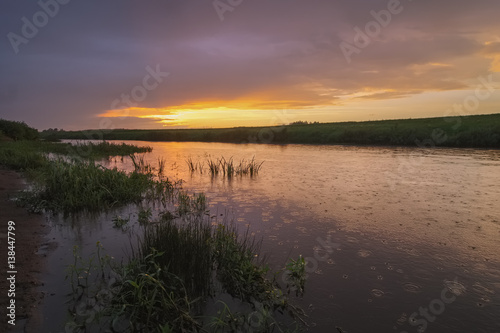 Summer landscape with the river in the rain at sunset. Ugra River in the Smolensk region