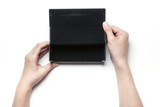 woman hand hold a black leather glasses case isolated white.