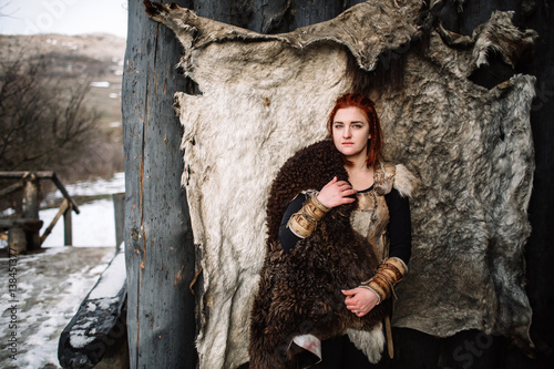 The girl dressed in a Viking outfit.