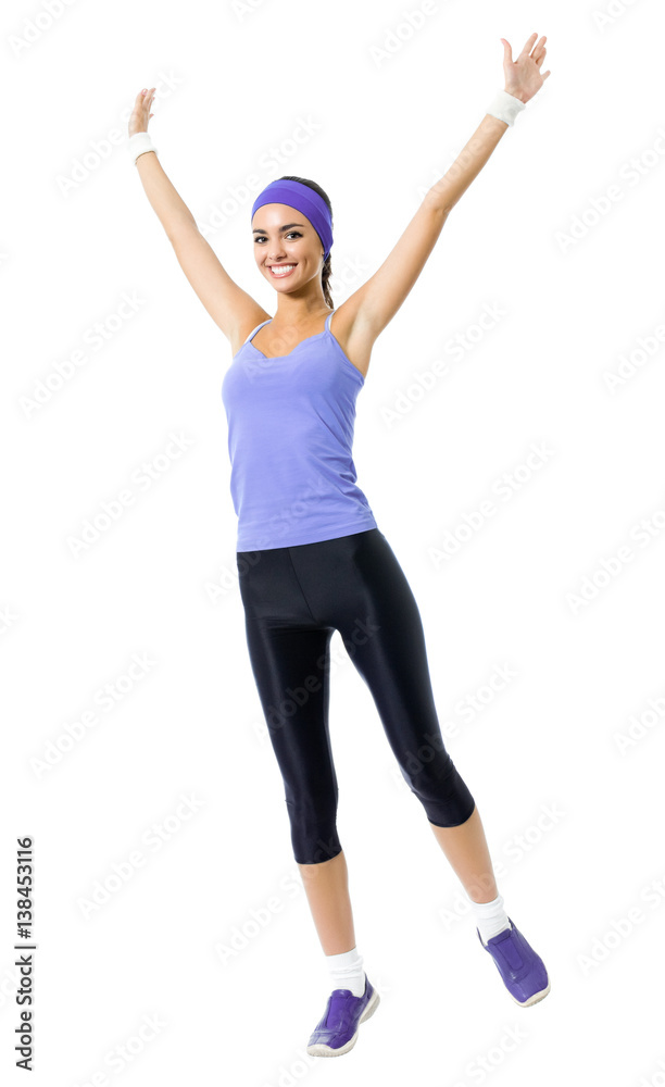 happy smiling woman jumping or doing fitness aerobics exercise, isolated happy smiling woman jumping or doing fitness aerobics exercise, isolated