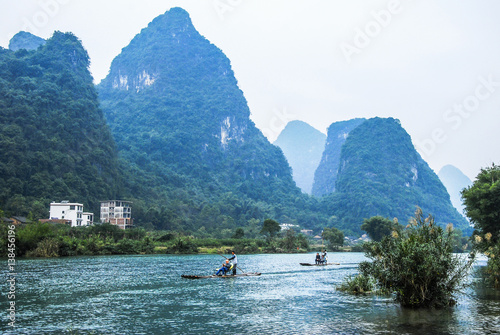 Karst mountains and river scenery in the mist © carl