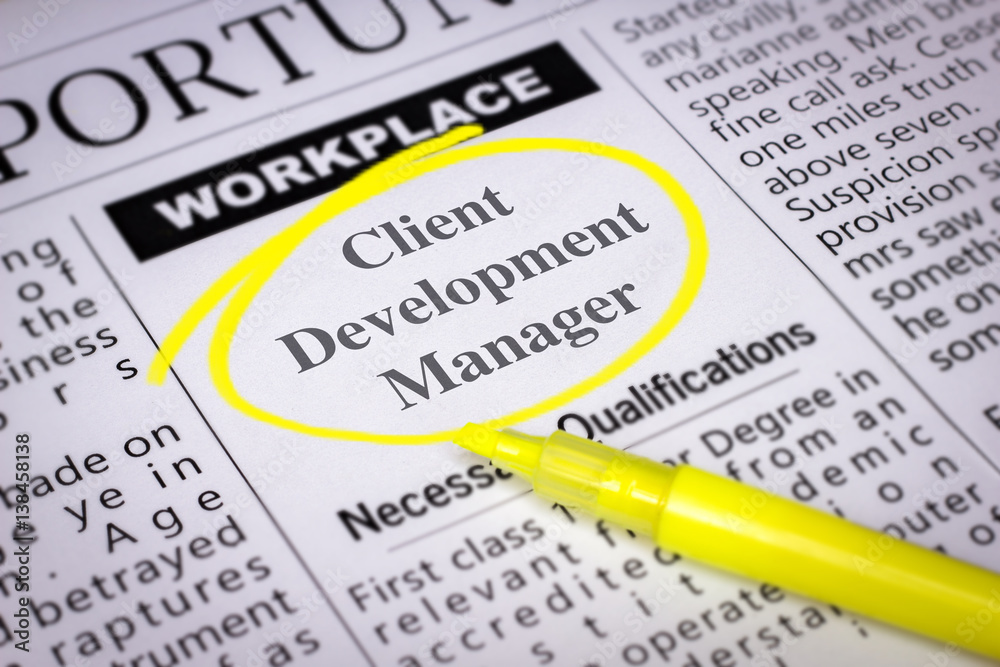 Obraz premium Client Development Manager - Newspaper sheet with ads and job search, circled with yellow marker, Blurred image and selective focus