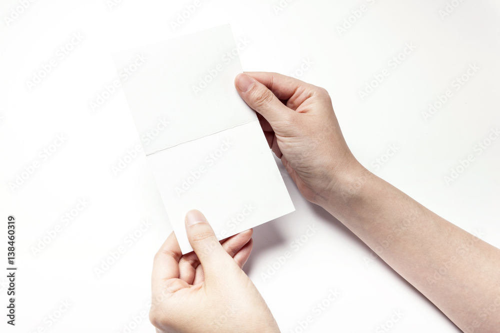 woman hand hold a empty post card isolated white. woman hand hold a empty post card isolated white.