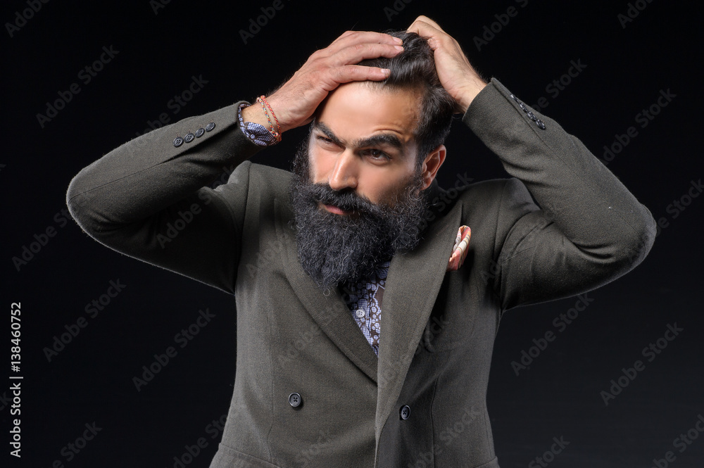 handsome long bearded man posing on black background handsome long bearded man posing on black background