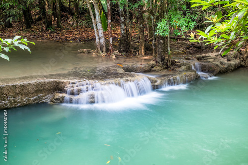 Waterfall flowing on tropical rainforest at huai mae khamin national park