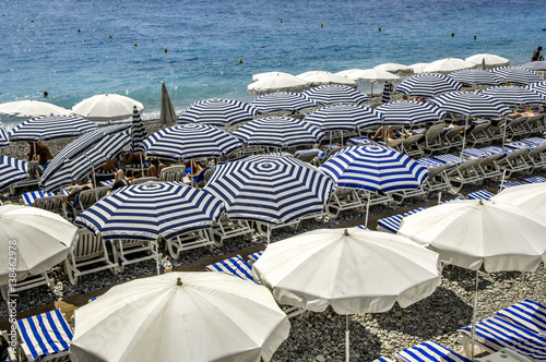 Canvas Print Sunloungers and sunshades in blue-white, France, Cote d Azur, Ni