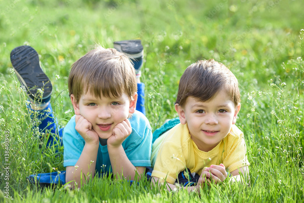 Happy kid enjoying sunny late summer and autumn day in nature on green grass. Happy kid enjoying sunny late summer and autumn day in nature on green grass.
