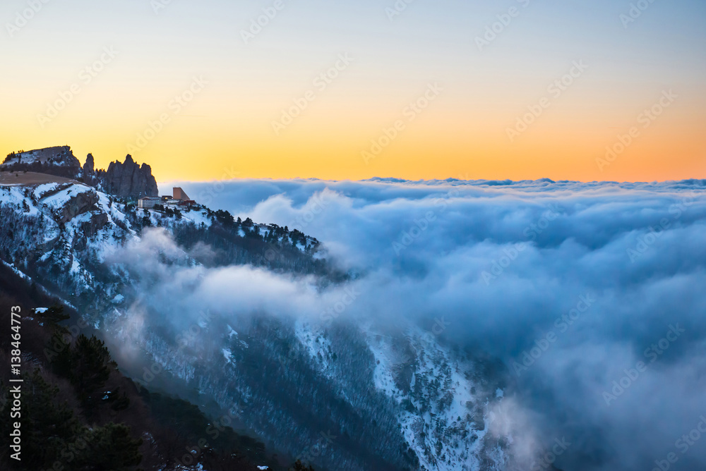 Fototapeta premium Sunset in mountains with clouds
