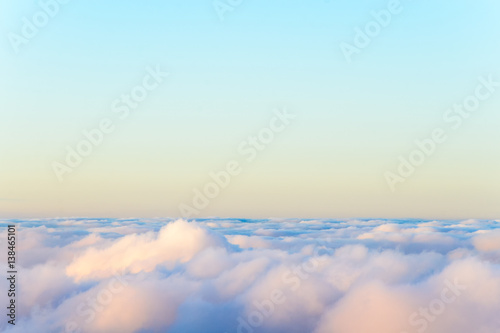 Above the vibrant clouds at sunset with clear sky and copy space