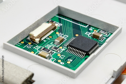 Circuit board with installed electronic components in the housing