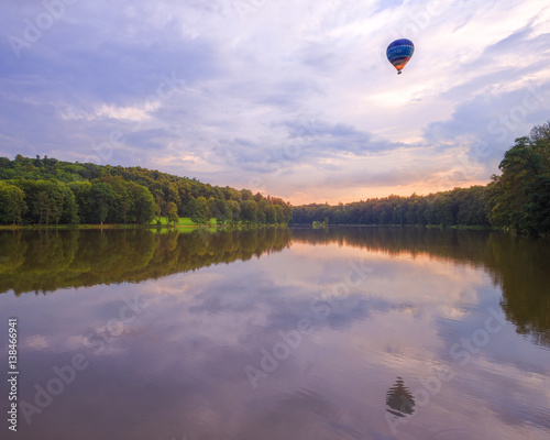 Balloon flying over the lake Konopatski Rybnik. Czech Republic.