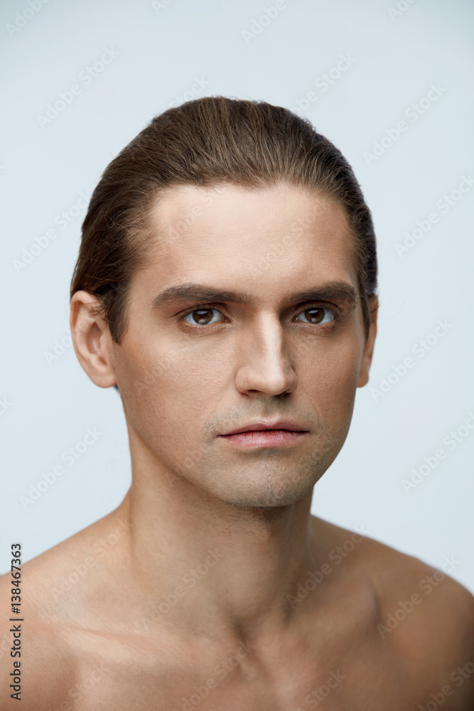 Fototapeta premium Skin And Body Care. Handsome Young Man With Clean Healthy Skin