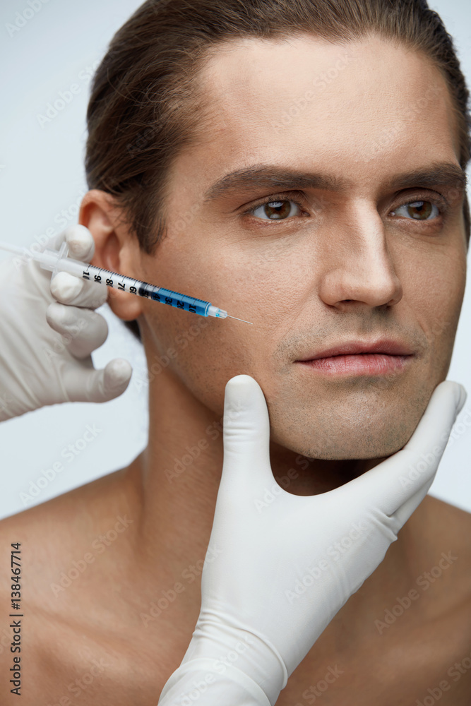 Plastic Surgery. Handsome Man Receiving Injections In Face Skin Plastic Surgery. Handsome Man Receiving Injections In Face Skin