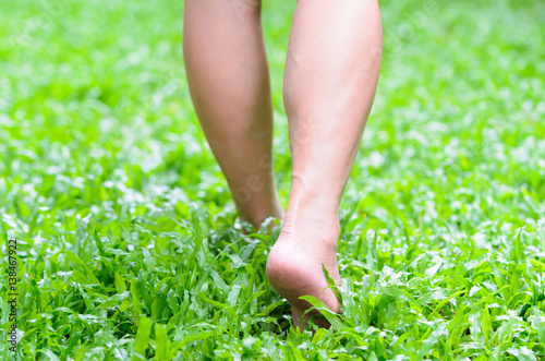 Foot step on green grass