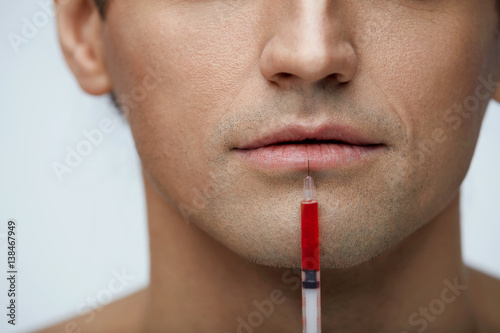 Closeup Handsome Man Face Receiving Injection, Lips Augmentation