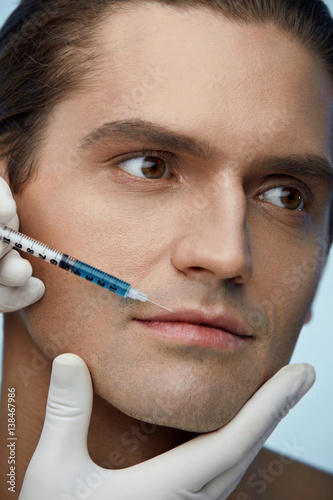 Closeup Of Handsome Man Face Getting Beauty Injection