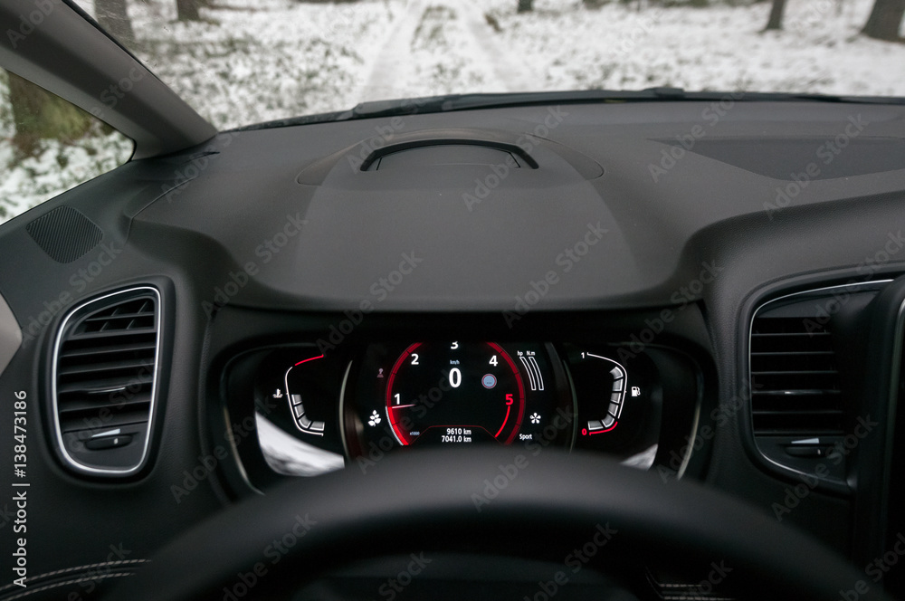 Speedometer, tachometer and odometer. Modern car dashboard.