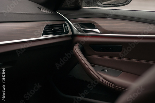 Luxury car interior. Leather and wood.