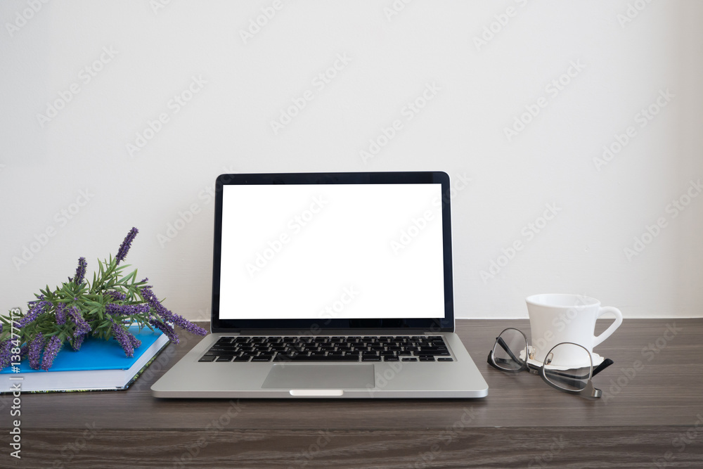 office wood table with blank screen on notebook, coffee cup, book and purple lavender flower. office wood table with blank screen on notebook, coffee cup, book and purple lavender flower.