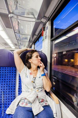 Woman as a commuter alone in the train / metro