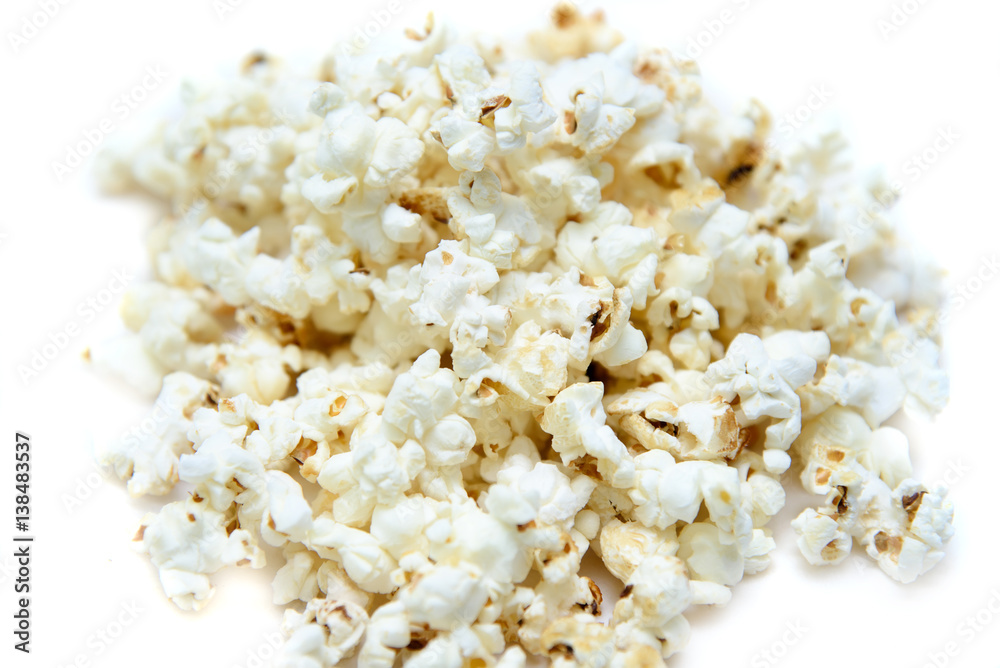 Pile popcorn on white background isolated.