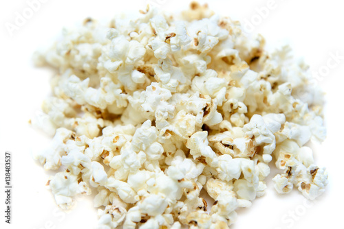 Pile popcorn on white background isolated.