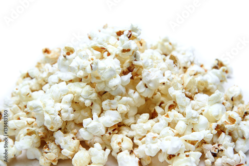 Popcorn pile on white background close-up.