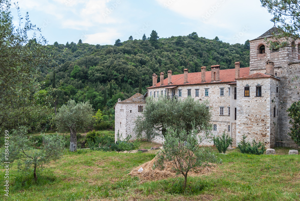 Ancient orthodox monastery surrounded by old olive trees, Mount Athos, Greece