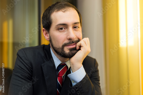 Smiling businessman in his office