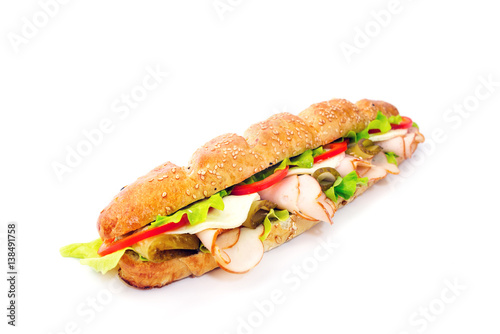 long sandwich with tomatoes and cheese on white background