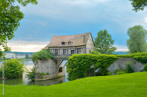 Old mill house on bridge, Seine river, Vernon, Normandy, France
