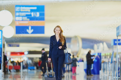 Young business woman in international airport