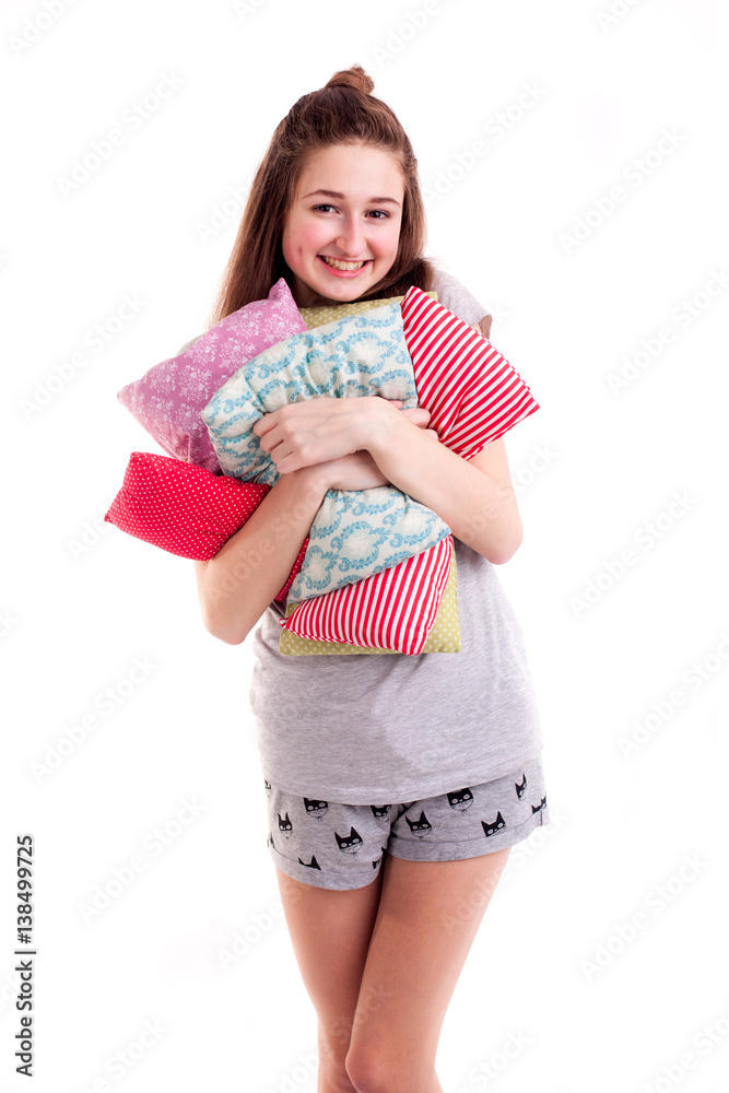 Smiling amazing girl hold pillows isolated Smiling amazing girl hold pillows isolated