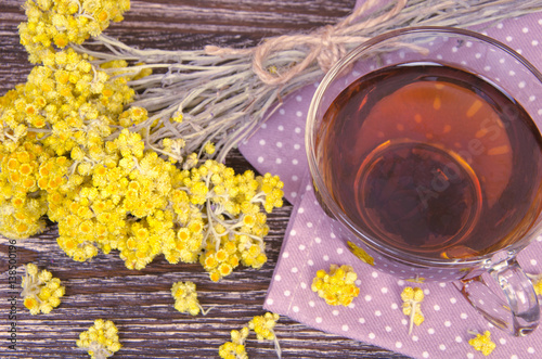 tea cup with dry flowers photo