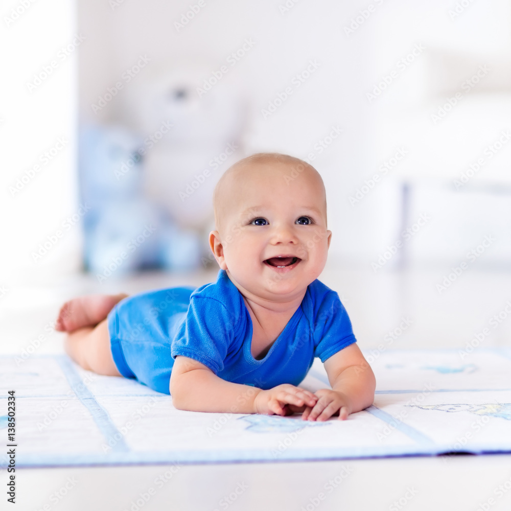 Baby boy playing and learning to crawl Baby boy playing and learning to crawl
