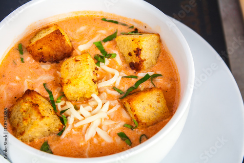 Cream of tomato with croutons and condiments