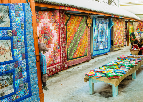 Market series with bright colorful patchwork quilts in winter sunny day © RomanovRV