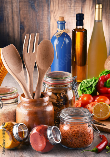 Composition with assorted food products and kitchen utensils