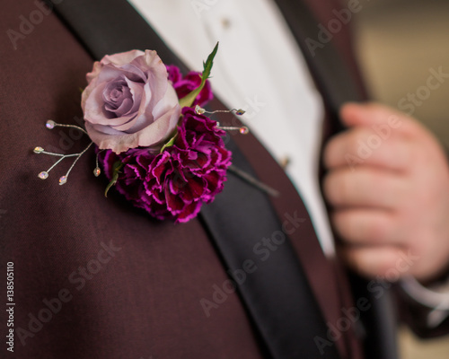 Pinned rose boutonniere to suit