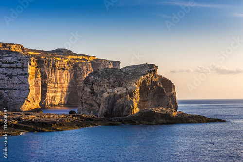 Wall Mural Gozo, Malta - The famous Fungus rock on the island of Gozo at Dwejra bay at suns