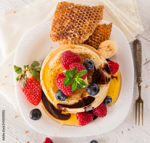 delicious pancakes on woode...