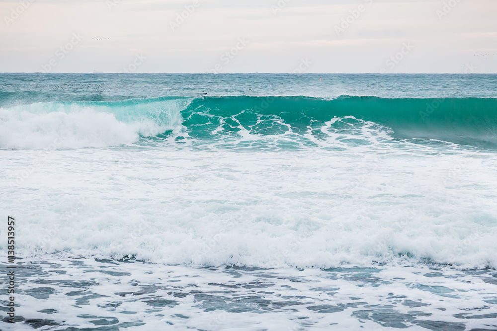 Fototapeta premium Blue wave in ocean and clouds sky. Wave for sufring