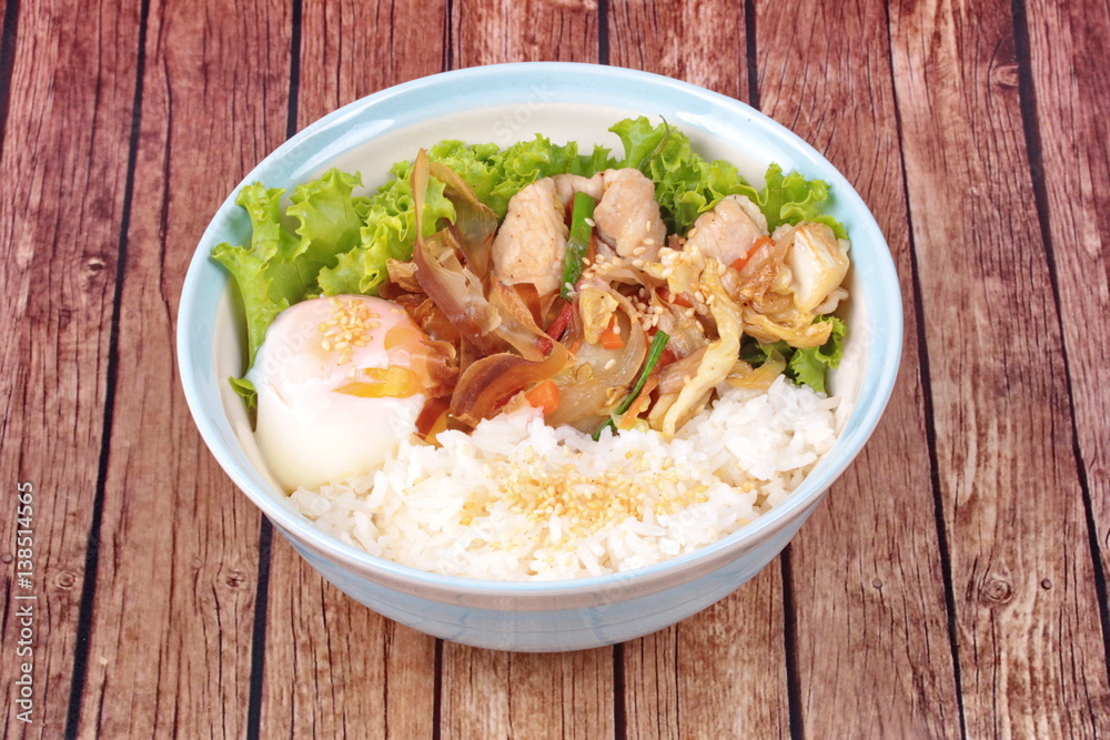 Japanese rice topped boil eggs and fried pork. Japanese rice topped boil eggs and fried pork.