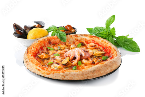 Delicious pizza with seafood on white background