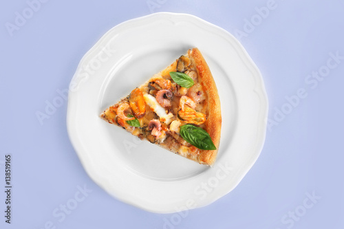 Delicious slice of seafood pizza on plate isolated on white