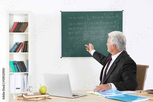 Senior teacher at lesson in...