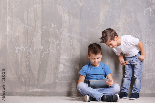 Cute little brothers using ...