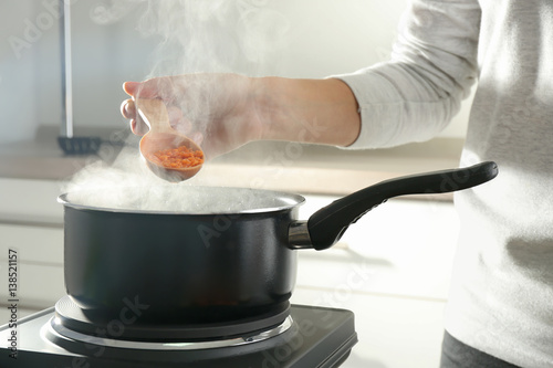 Chef cooking tasty dish in kitchen