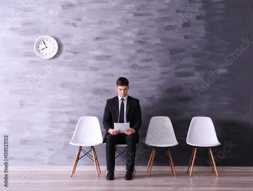 Young man waiting for job i...